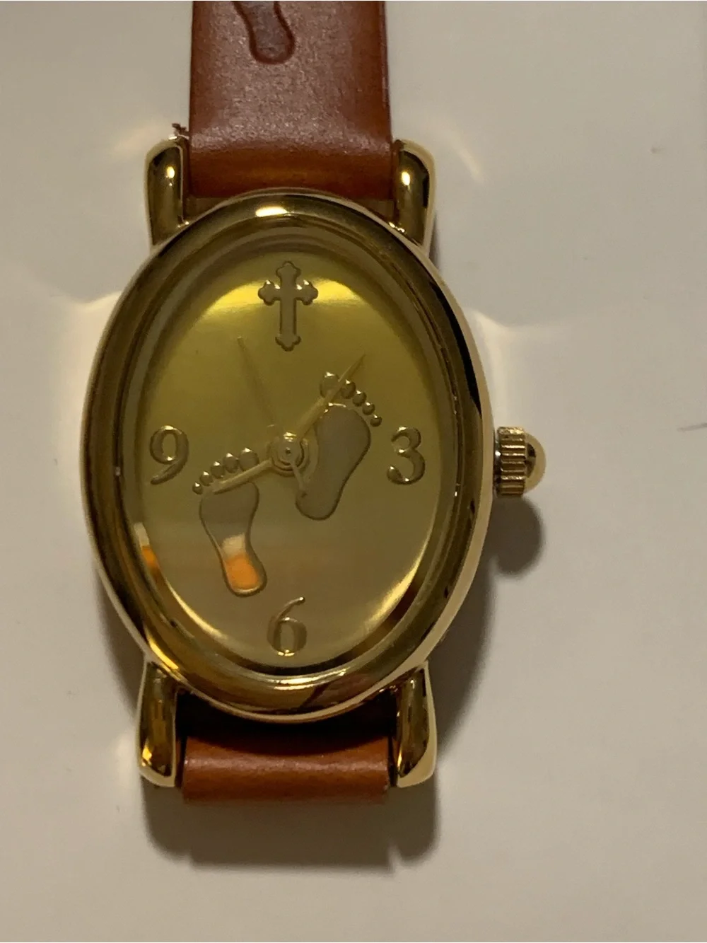 Avon “Footprints in the Sand” Gold-tone Oval Watch with Brown Leather Strap